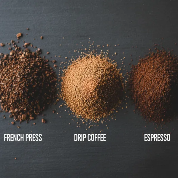 Examples of coffee grind sizes for French press, drip, and espresso on a dark surface.